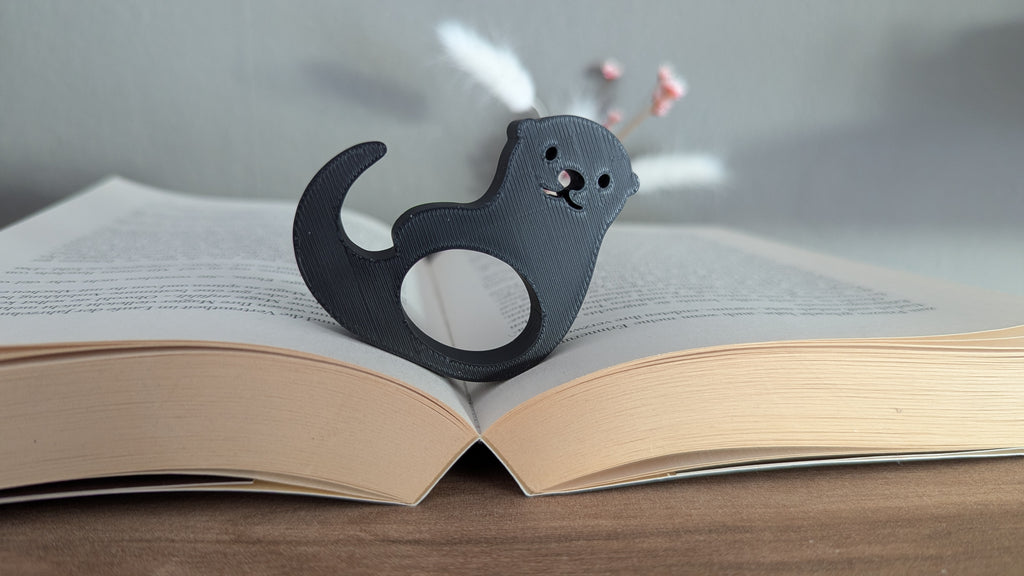 Seitenhalter / Daumen-Lesehilfe Otter